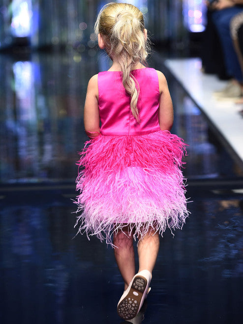 A must-have for the fashion-savvy young girl, this Marc Defang 5118 Girls Short Feather Ombre Pageant Dress features a unique, hand sewn ostrich feather all-over skirt with an ombre pattern and a beaded waistline. Embellished with hand-placed crystals along the top, this dress is fully lined and features a center back invisible zipper for a comfortable fit.  Sizes: 4,5,6,7,8,9,10,11,12,13,14  Colors: Pink, Hot Pink  *Choose Custom color from swatches! allow 25-30 days delivery