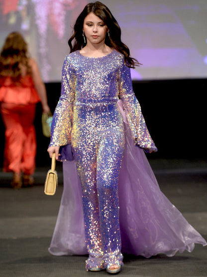 Marc Defang 8004 Sequin Bell Sleeve Pageant Jumpsuit Overskirt Fun Fashion   Price is inclusive of overskirt  Fully beaded jumpsuit Bell sleeve Option of matching overskirt Knitted inner comfort lining  Available Sizes: 6   Available Colors: Iridescent Purple