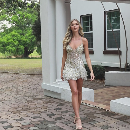 The Primavera Couture 4401 is a stunning short fit-and-flare homecoming dress designed to make you feel confident and elegant. Featuring a sheer beaded bodice with a flattering corset, it offers both support and style. The playful ruffle skirt adds movement and charm, perfect for dancing the night away. This cocktail gown combines sophistication with youthful flair, ensuring you stand out at any special event.

Sizes: 000-18

Colors: Black, Pink, Lavender, Ivory/Gold