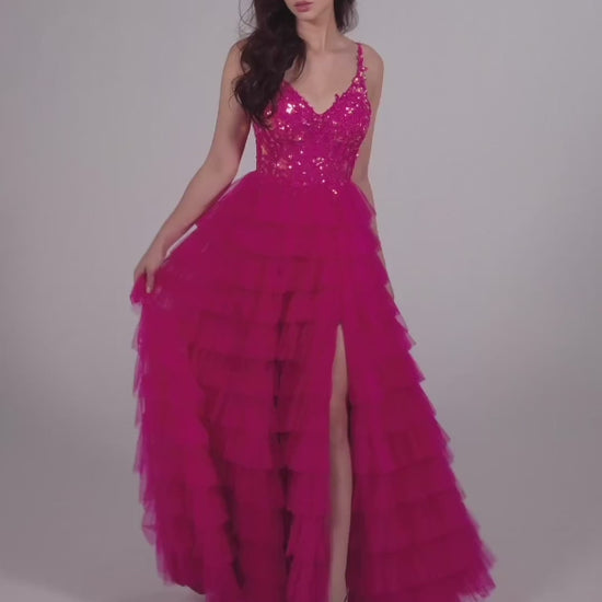 This Ellie Wilde EW35059 prom dress exudes elegance and glamour. The long tulle layers, A-line silhouette, and lace Sequin corset enhance your natural curves, while the maxi slit and sequin details add a touch of sparkle. Perfect for prom or any formal event, this dress is sure to make a statement.  Sizes: 00-20  Colors: ﻿BLACK, MAGENTA, ROYAL BLUE, BARBIE PINK
