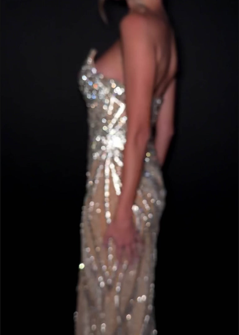 Ashley Lauren Style 12011 is a long prom dress designed for pageant and formal evening events. This elegant gown features Ashley Lauren's signature attention to fit and detail, creating a flattering silhouette that stands out on stage and in photos.

Available Colors: Silver, Gold, Red