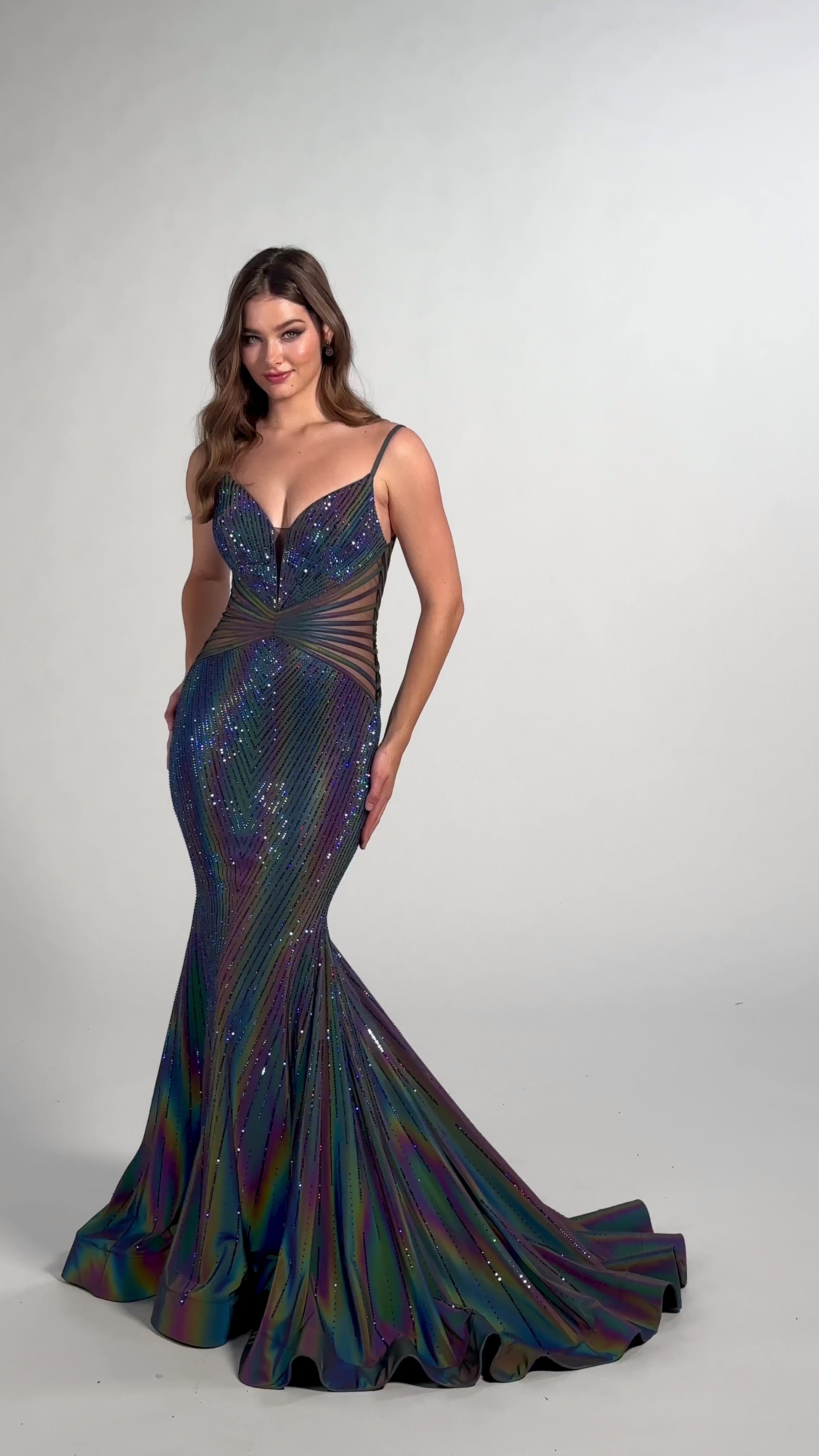 The Ellie Wilde EW35704 Prom Dress is a show-stopping style perfect for any special occasion. Featuring a long, fitted SUPERNOVA mermaid silhouette, sheer bodice with boning, this holographic gown is sure to turn heads. A unique style for a memorable night.   Sizes: 00-24  Colors: SUPERNOVA