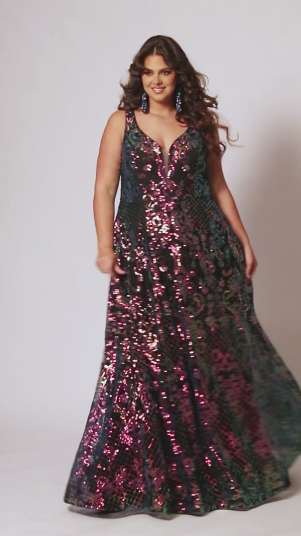 This elegant, plus size Sydneys Closet SC7367 Long Prom Dress features a V-neckline, sequins, pockets, and a long train--all crafted from a luxurious fabric for a stylish and comfortable look. Its timeless design makes it perfect for formal occasions. Make a trendy fashion statement at Prom or any formal when you wear this eye-catching plus size evening dress. 