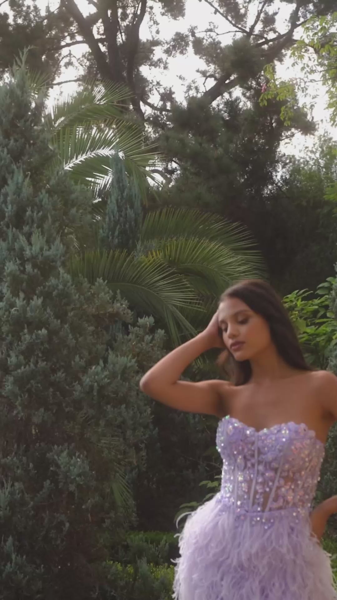 Expertly crafted from sheer sequin lace, the Ladivine A1225 dress features a corset top and feather detailing. The dramatic high low slit adds a touch of elegance to this formal gown, perfect for any prom or special occasion. Ignite the night in our sultry lilac gown—a tantalizing fusion of allure and opulence. 