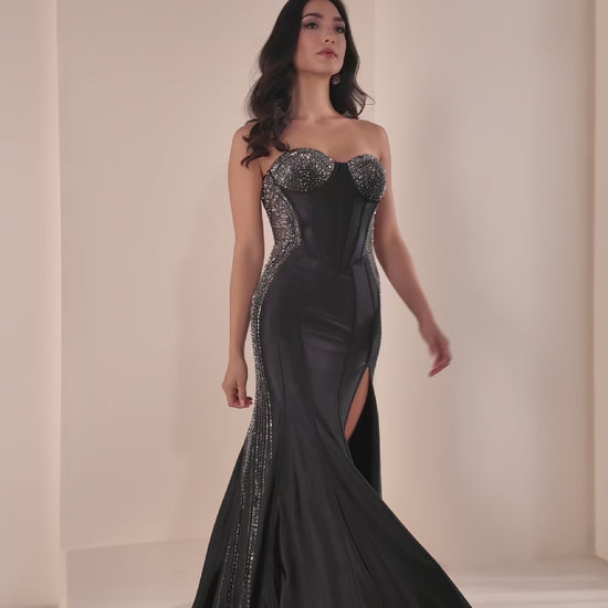 Ellie Wilde's EW37010 delivers sophisticated elegance with its fitted silhouette and strategic sheer cutout details. This stunning prom gown features intricate beading that catches the light beautifully, while the high slit adds modern movement and allure. The expertly tailored design flatters the figure, making it an ideal choice for those seeking a show-stopping formal look that balances glamour with contemporary style.

Sizes: 00-24

Colors: Black, Red, Yellow, Sakura Pink