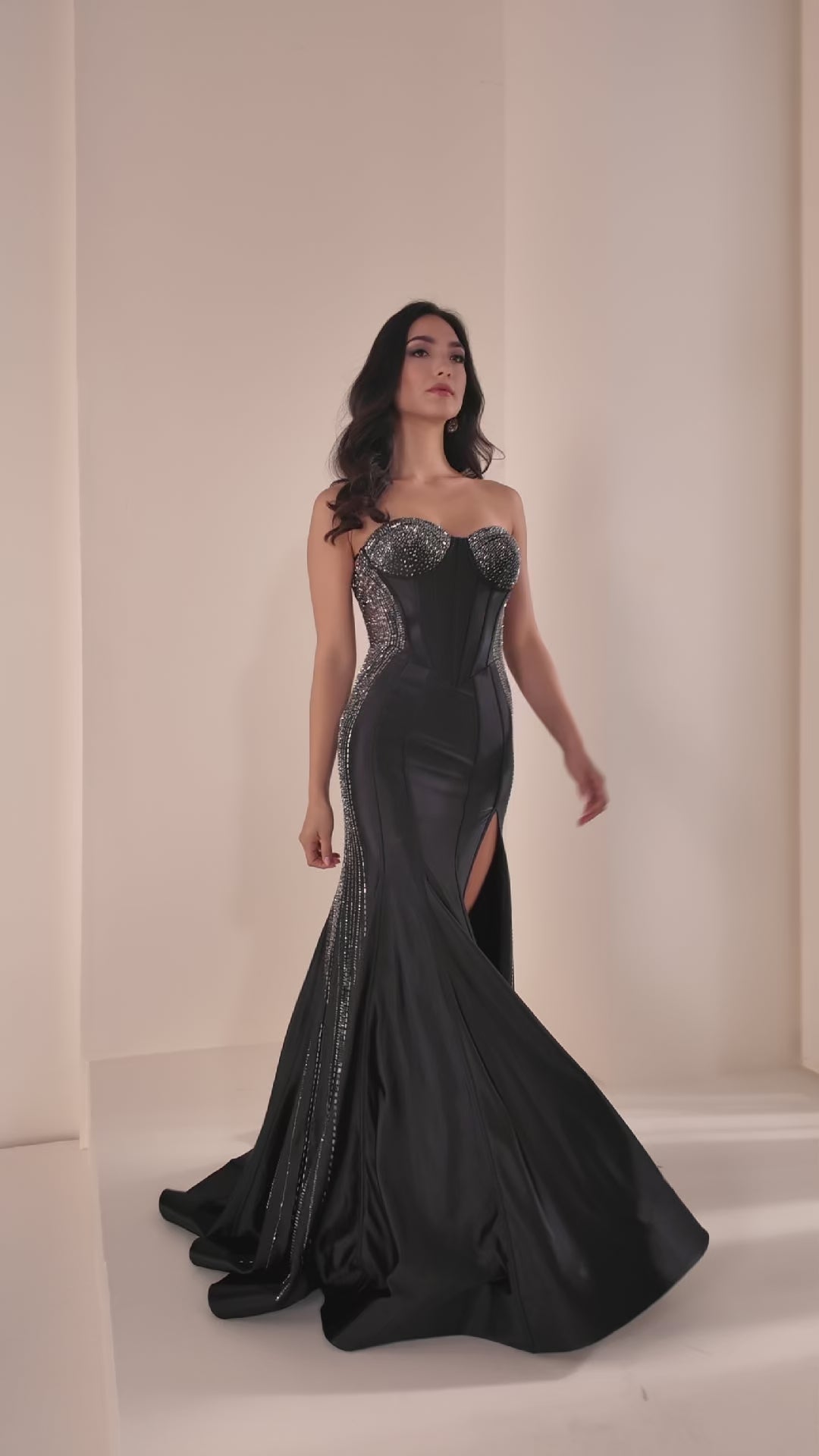 Ellie Wilde's EW37010 delivers sophisticated elegance with its fitted silhouette and strategic sheer cutout details. This stunning prom gown features intricate beading that catches the light beautifully, while the high slit adds modern movement and allure. The expertly tailored design flatters the figure, making it an ideal choice for those seeking a show-stopping formal look that balances glamour with contemporary style.

Sizes: 00-24

Colors: Black, Red, Yellow, Sakura Pink