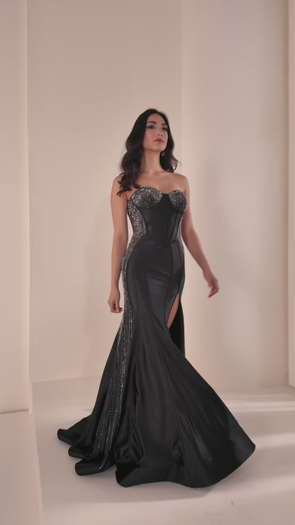 Ellie Wilde's EW37010 delivers sophisticated elegance with its fitted silhouette and strategic sheer cutout details. This stunning prom gown features intricate beading that catches the light beautifully, while the high slit adds modern movement and allure. The expertly tailored design flatters the figure, making it an ideal choice for those seeking a show-stopping formal look that balances glamour with contemporary style.

Sizes: 00-24

Colors: Black, Red, Yellow, Sakura Pink