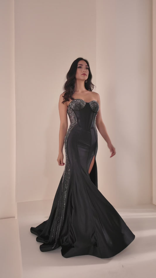 Ellie Wilde's EW37010 delivers sophisticated elegance with its fitted silhouette and strategic sheer cutout details. This stunning prom gown features intricate beading that catches the light beautifully, while the high slit adds modern movement and allure. The expertly tailored design flatters the figure, making it an ideal choice for those seeking a show-stopping formal look that balances glamour with contemporary style.

Sizes: 00-24

Colors: Black, Red, Yellow, Sakura Pink