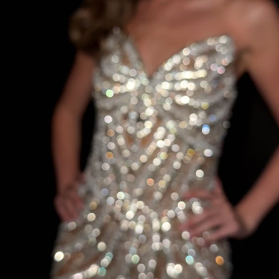 Elevate your special occasion with the Ashley Lauren 4931 Short Crystal V Neck Cocktail Dress. This elegant gown features intricate beading and a flattering V-neckline, perfectly blending sophistication with sparkle. Designed for formal events and homecoming, its short length offers a modern, chic silhouette that ensures you stand out with grace and style.&nbsp;Make a striking entrance in the ASHLEYlauren Style 4931 mini dress, crafted from fully beaded fabric in black and ivory/silver hues. This short, str