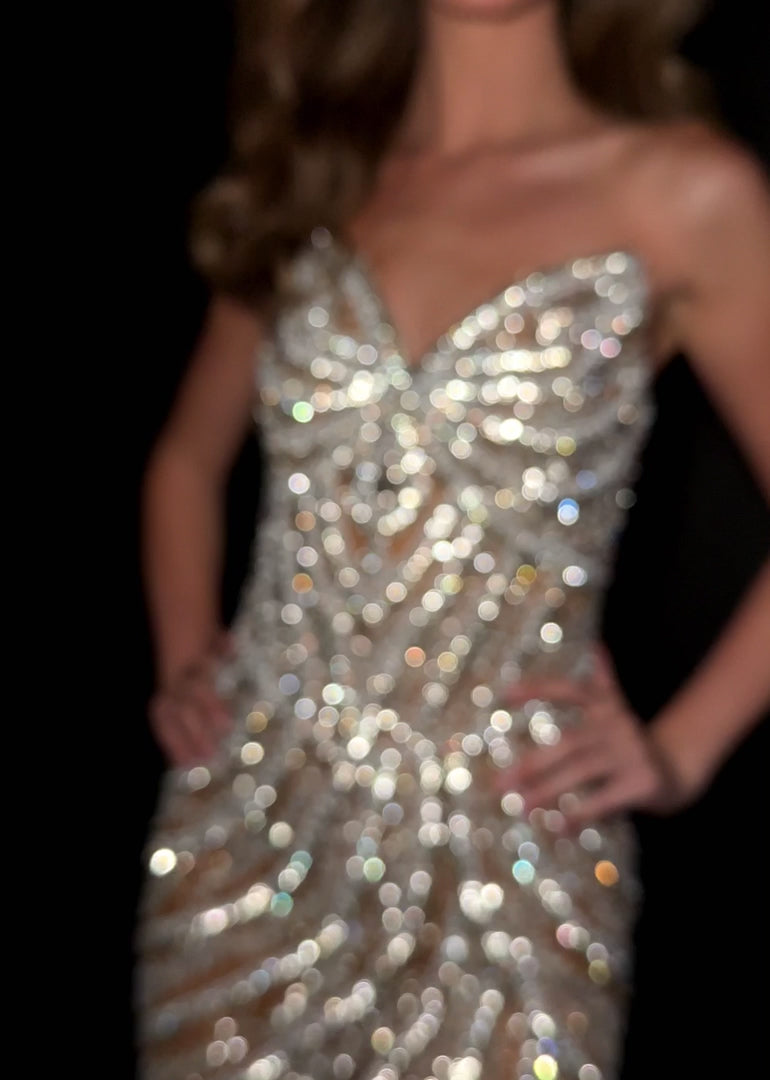 Elevate your special occasion with the Ashley Lauren 4931 Short Crystal V Neck Cocktail Dress. This elegant gown features intricate beading and a flattering V-neckline, perfectly blending sophistication with sparkle. Designed for formal events and homecoming, its short length offers a modern, chic silhouette that ensures you stand out with grace and style.&nbsp;Make a striking entrance in the ASHLEYlauren Style 4931 mini dress, crafted from fully beaded fabric in black and ivory/silver hues. This short, str