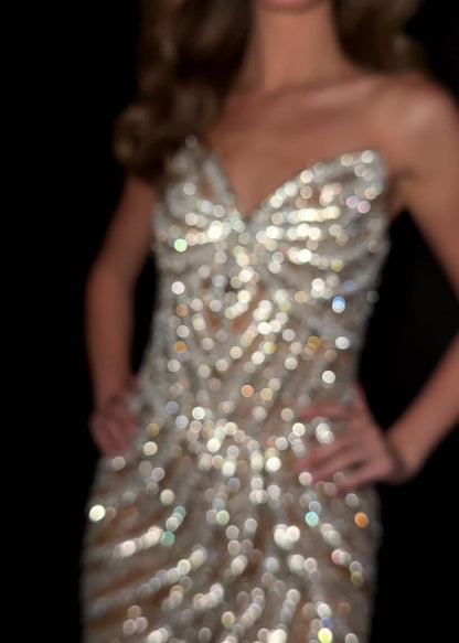 Elevate your special occasion with the Ashley Lauren 4931 Short Crystal V Neck Cocktail Dress. This elegant gown features intricate beading and a flattering V-neckline, perfectly blending sophistication with sparkle. Designed for formal events and homecoming, its short length offers a modern, chic silhouette that ensures you stand out with grace and style.&nbsp;Make a striking entrance in the ASHLEYlauren Style 4931 mini dress, crafted from fully beaded fabric in black and ivory/silver hues. This short, str