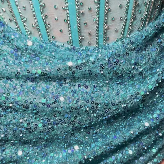 Elevate your evening with the Ashley Lauren 4564 cocktail dress, featuring intricate sequin beading that catches the light with every movement. This short homecoming gown combines a structured corset silhouette with sheer detailing for a refined and alluring look. Perfect for special occasions, it offers a sophisticated blend of glamour and elegance to make a memorable statement.&nbsp;Ashley Lauren 4564&nbsp;Strapless cocktail dress beaded with exposed boning. The wrap sequin skirt completes the look.

Stra