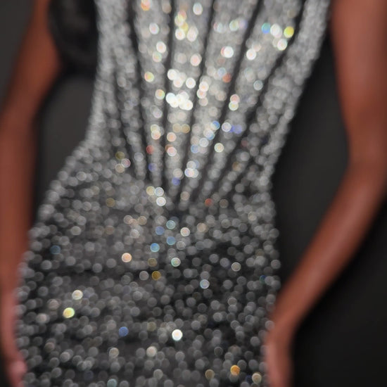 ASHLEYlauren Style 12356 is a fully beaded evening gown that commands attention with its fitted silhouette and strapless neckline.&nbsp; Ashley Lauren 12356 The expertly contoured bodice features vertical beadwork that accentuates the waist and elongates the figure, while a sweeping train with slit adds dramatic movement. Crafted from jersey fabric with pearl corset bustier detailing, this gown delivers high-impact sparkle from every angle. Ideal for pageants, red carpet events, prom, galas, and special occ