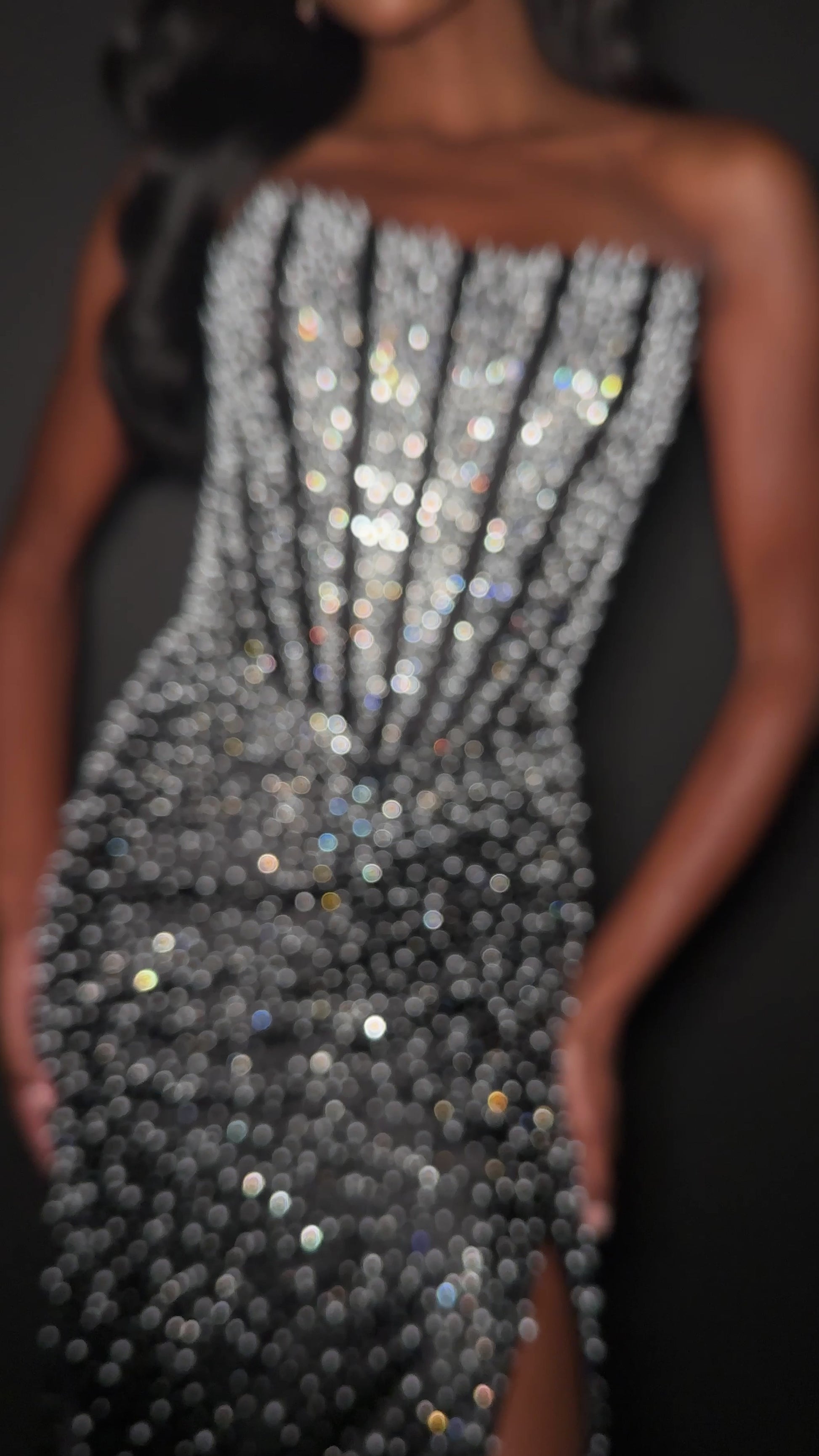 ASHLEYlauren Style 12356 is a fully beaded evening gown that commands attention with its fitted silhouette and strapless neckline.&nbsp; Ashley Lauren 12356 The expertly contoured bodice features vertical beadwork that accentuates the waist and elongates the figure, while a sweeping train with slit adds dramatic movement. Crafted from jersey fabric with pearl corset bustier detailing, this gown delivers high-impact sparkle from every angle. Ideal for pageants, red carpet events, prom, galas, and special occ