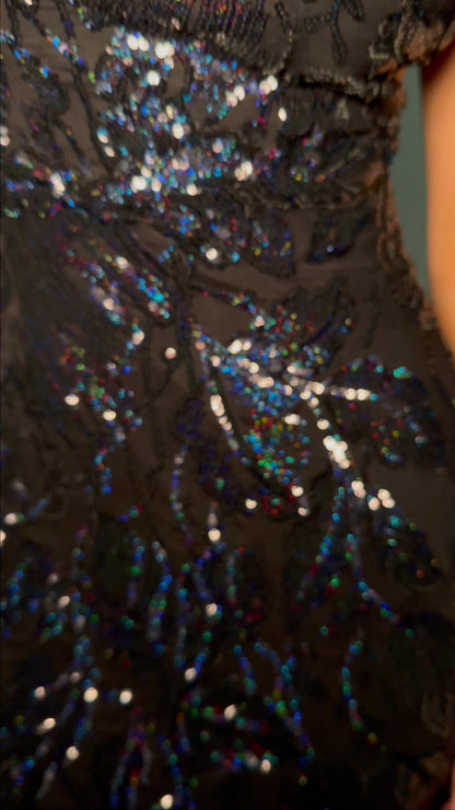 Get ready to command attention in the Ashley Lauren 11472 Long Prom Dress. With a stunning V-neck, sequin embellishments, and a mermaid skirt made with stretchy fabric, this gown is designed to enhance your figure and make you shine. Perfect for formal events, pageants, and more. Can you say iconic? This stretch sequin gown features a v-neckline and a pleated tulle skirt to help you slay your next event.