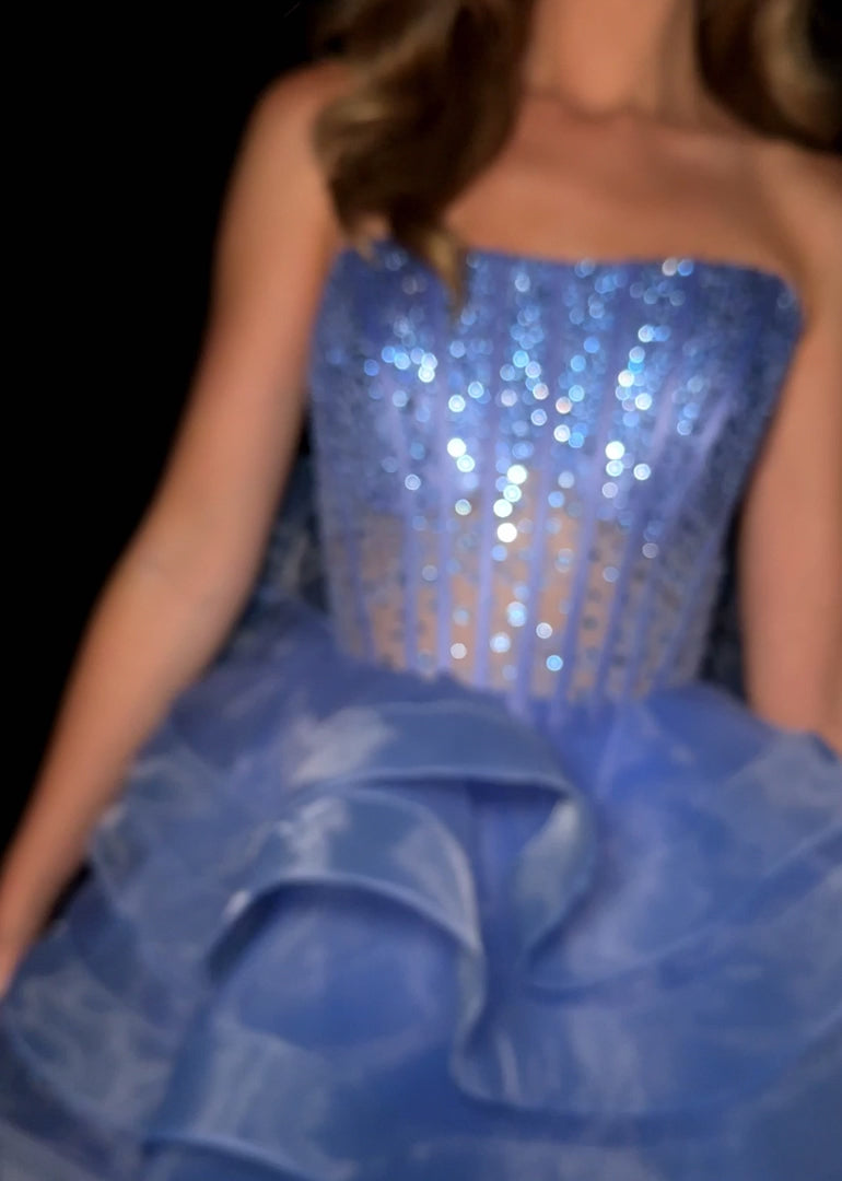 Elevate your evening with the Ashley Lauren 4883, a short fit-and-flare cocktail gown featuring delicate ruffle layers and a sheer corset bodice. This homecoming dress combines elegance and modern design, offering a flattering silhouette that enhances your natural shape. Perfect for special occasions, its intricate details and graceful flow ensure you stand out with timeless sophistication. Make a statement in this stunning ASHLEYlauren Style 4883 mini dress. Featuring a fully boned corset-style bodice with