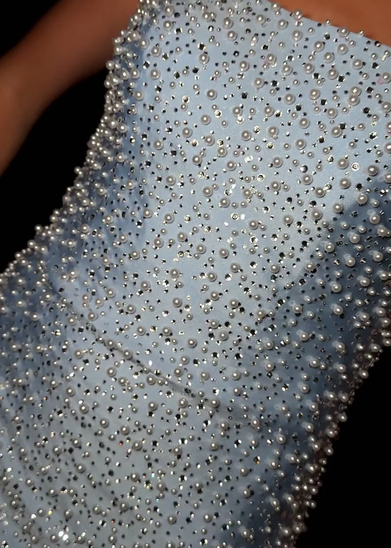 Elevate your special occasion with the Ashley Lauren 4715 Short Crystal Pearl Cocktail Dress. This mini homecoming dress features a graceful scoop neck and delicate crystal pearl embellishments, offering a refined and elegant silhouette. Perfect for receptions or cocktail events, its sophisticated design ensures you stand out with timeless charm and subtle sparkle. Stun the crowd in this chic strapless cocktail dress. Featuring a stunning neckline and V-neck back, this dress is covered in crystals and pearl