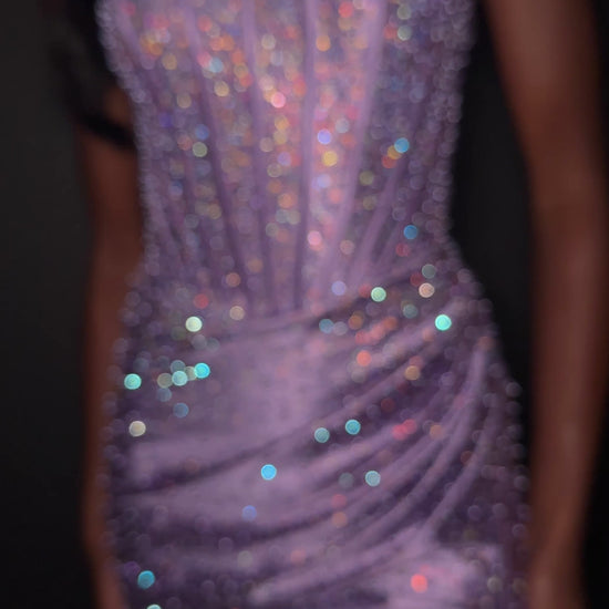 ASHLEYlauren Style 12356 is a fully beaded evening gown that commands attention with its fitted silhouette and strapless neckline.&nbsp; Ashley Lauren 12356 The expertly contoured bodice features vertical beadwork that accentuates the waist and elongates the figure, while a sweeping train with slit adds dramatic movement. Crafted from jersey fabric with pearl corset bustier detailing, this gown delivers high-impact sparkle from every angle. Ideal for pageants, red carpet events, prom, galas, and special occ