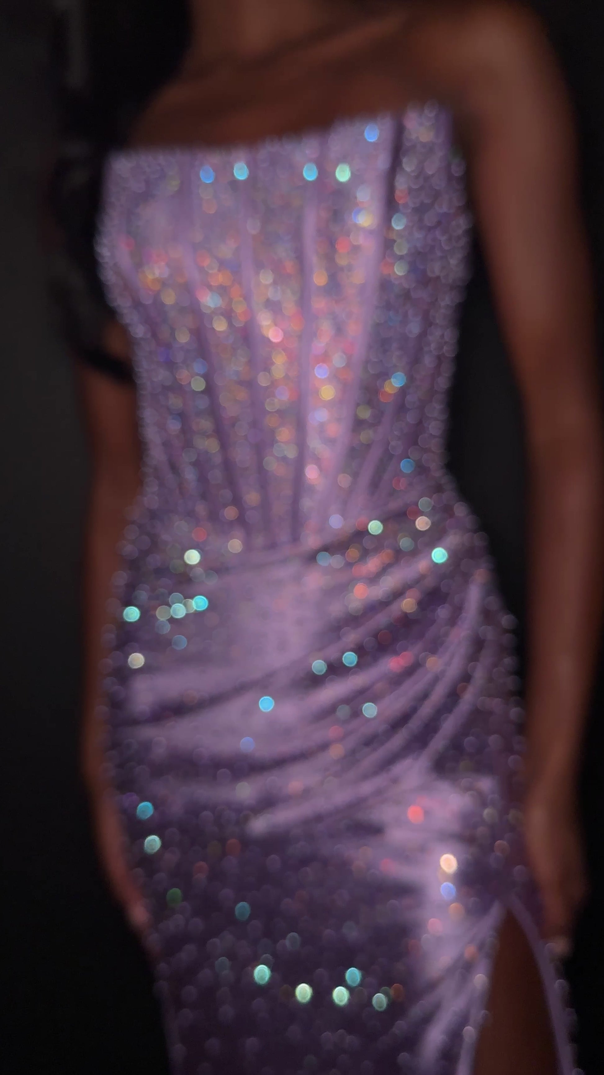 ASHLEYlauren Style 12356 is a fully beaded evening gown that commands attention with its fitted silhouette and strapless neckline.&nbsp; Ashley Lauren 12356 The expertly contoured bodice features vertical beadwork that accentuates the waist and elongates the figure, while a sweeping train with slit adds dramatic movement. Crafted from jersey fabric with pearl corset bustier detailing, this gown delivers high-impact sparkle from every angle. Ideal for pageants, red carpet events, prom, galas, and special occ