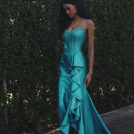 The ASHLEYlauren Style 12240 exemplifies contemporary formal wear design with its expertly engineered silhouette. This fitted gown features a strapless sweetheart bodice with precision ruching that creates dimensional shaping, paired with a luxurious shimmer jersey fabric that provides both structure and movement