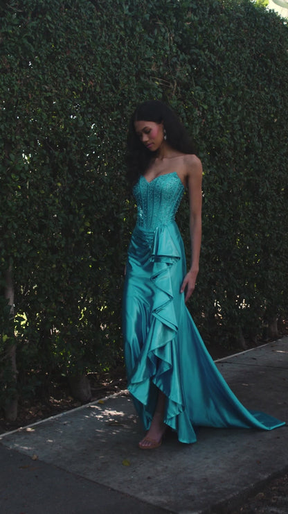 The ASHLEYlauren Style 12240 exemplifies contemporary formal wear design with its expertly engineered silhouette. This fitted gown features a strapless sweetheart bodice with precision ruching that creates dimensional shaping, paired with a luxurious shimmer jersey fabric that provides both structure and movement