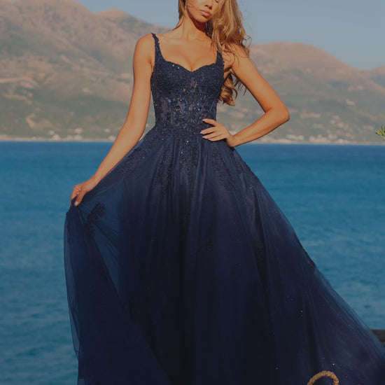 Elevate your formal event presence with the Amarra 89429, a stunning ballgown that seamlessly blends sophistication with dramatic elegance. This A-line silhouette features an intricately embellished sheer lace corset bodice that creates a refined, structured look while the voluminous tulle skirt provides the timeless grandeur expected of a show-stopping prom dress. The delicate lace detailing catches light beautifully, ensuring you command attention throughout the evening. Perfect for prom, pageants, or any