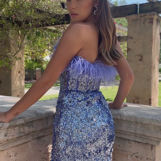 This stunning Ava Presley 28215 dress will ensure you make a statement at your special occasion. Featuring a short fitted sequin bodice, sheer corset and feather accents, this dress is perfect for a homecoming, cocktail party or other formal event. Glittering with elegant sophistication, you'll be perfectly dressed and turn heads.  Sizes: 00-16  Colors: Light Blue, Periwinkle, Off White