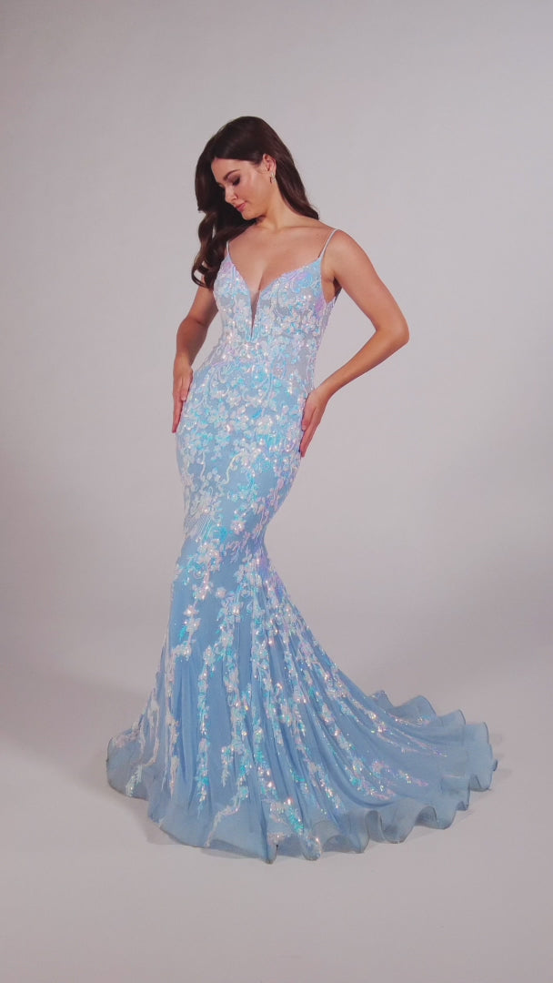 This Ellie Wilde EW35048 prom dress features a long, sheer bodice and stunning sequin detailing. The mermaid silhouette and plunging V-neckline create a flattering and glamorous look. Perfect for a formal event, this dress will make you stand out from the crowd.  Sizes: 00-16  Colors: Ice Blue, Hot Pink, Lavender, Navy Blue, Black