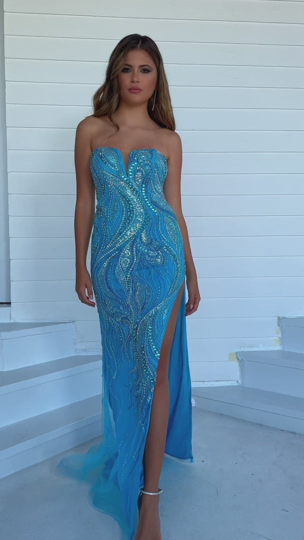 This Ava Presley 39219 long prom dress exudes elegance and sophistication. The fitted silhouette, strapless design, and sweetheart neckline beautifully showcase your figure, while the intricate beaded detailing adds a touch of glamour. With a high slit and formal pageant gown style, this dress is perfect for any special occasion.