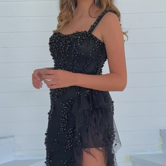 Expertly crafted by the renowned designer, Ava Presley, this long prom dress features exquisite beading and a stunning ruffled organza train with delicate feather accents. The high slit adds a touch of allure, making it the perfect choice for any formal event or pageant. Elevate your style with this one-of-a-kind gown.