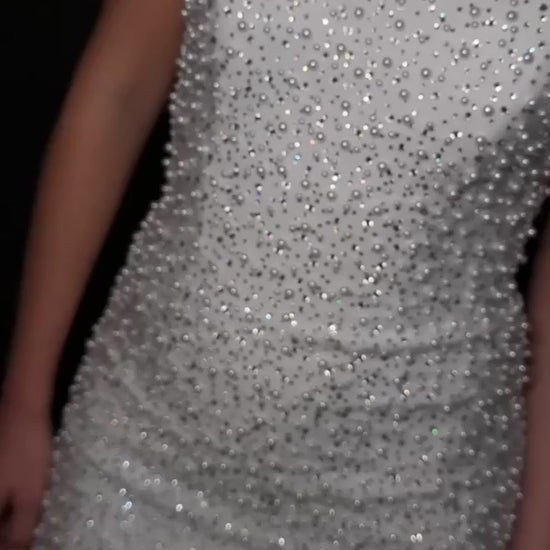 Elevate your special occasion with the Ashley Lauren 4715 Short Crystal Pearl Cocktail Dress. This mini homecoming dress features a graceful scoop neck and delicate crystal pearl embellishments, offering a refined and elegant silhouette. Perfect for receptions or cocktail events, its sophisticated design ensures you stand out with timeless charm and subtle sparkle. Stun the crowd in this chic strapless cocktail dress. Featuring a stunning neckline and V-neck back, this dress is covered in crystals and pearl