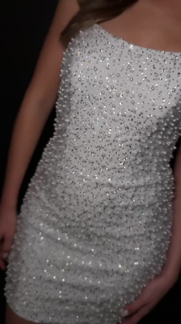 Elevate your special occasion with the Ashley Lauren 4715 Short Crystal Pearl Cocktail Dress. This mini homecoming dress features a graceful scoop neck and delicate crystal pearl embellishments, offering a refined and elegant silhouette. Perfect for receptions or cocktail events, its sophisticated design ensures you stand out with timeless charm and subtle sparkle. Stun the crowd in this chic strapless cocktail dress. Featuring a stunning neckline and V-neck back, this dress is covered in crystals and pearl