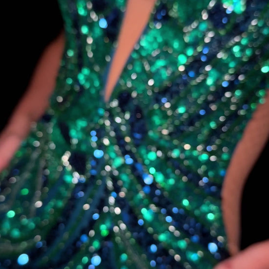 Elevate your evening with the Ashley Lauren 4893, a short fitted homecoming dress that dazzles with intricate sequin detailing and delicate sheer beading. Its flattering V-neckline enhances elegance, while the tailored silhouette ensures a sophisticated, confident look perfect for cocktail events and special occasions.&nbsp;

Turn heads in the ASHLEYlauren Style 4893 fully beaded mini dress. This striking cocktail dress features a plunging neckline, open back, and shimmering beadwork in a geometric pattern.