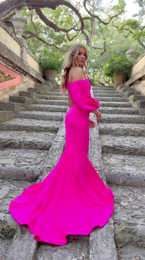 Expertly crafted by Ava Presley, this 38352 Long Prom Jersey Dress is the epitome of elegance. The one shoulder design and long puff sleeves add a touch of sophistication, while the crystal detailing and high slit mermaid silhouette make it a show-stopping formal choice. Perfect for pageants or any special occasion.