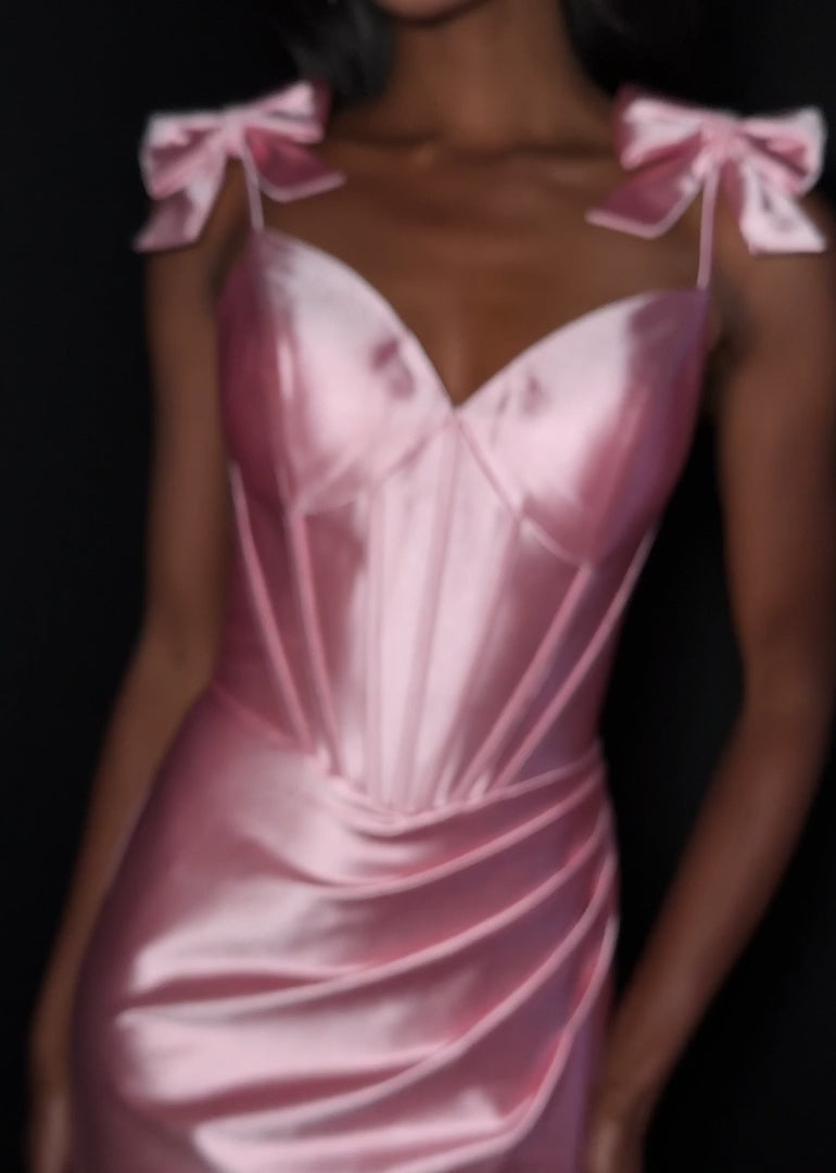 Ashley Lauren 12239 Prom Dress Bows. Step into the spotlight in this romantic shimmer jersey gown complete with oversized bow detailed straps, a sweetheart neckline, and flattering wrap skirt. ASHLEYlauren Style 12239 has a fitted silhouette that hugs your curves before flowing into a soft, elegant skirt with sweep train.