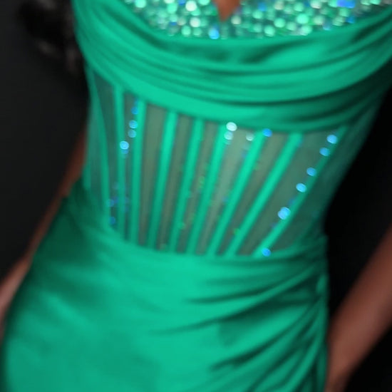 Elevate your evening with the Ashley Lauren 4864, a short fitted homecoming dress that combines elegance and allure. Crafted from smooth jersey fabric, this cocktail gown features a flattering corset bodice adorned with sparkling crystals, enhancing your silhouette with refined glamour. The tasteful slit adds a touch of sophistication and movement, making it perfect for memorable occasions. Designed to highlight your confidence and style, this dress is an exquisite choice for your next special event. Make a