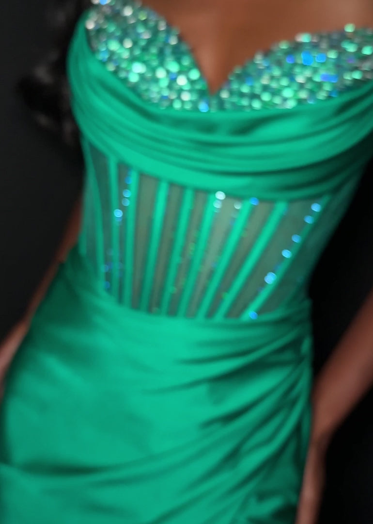 Elevate your evening with the Ashley Lauren 4864, a short fitted homecoming dress that combines elegance and allure. Crafted from smooth jersey fabric, this cocktail gown features a flattering corset bodice adorned with sparkling crystals, enhancing your silhouette with refined glamour. The tasteful slit adds a touch of sophistication and movement, making it perfect for memorable occasions. Designed to highlight your confidence and style, this dress is an exquisite choice for your next special event. Make a