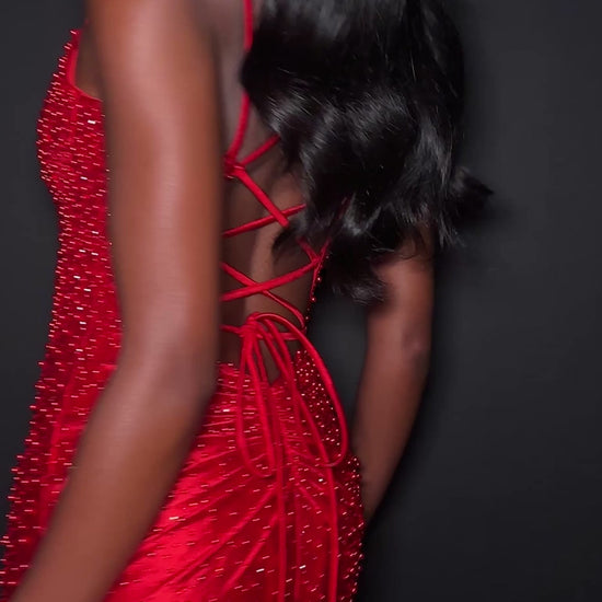 Ashley Lauren 12357 Make an entrance in ASHLEYlauren Style 12357 pearl crystal prom dress. This gown features full pearl beading, a fitted silhouette, lace up back and sleek sweetheart neckline. The vertical beadwork accentuates the waist and elongates the figure.