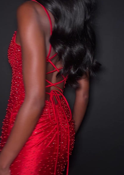 Ashley Lauren 12357 Make an entrance in ASHLEYlauren Style 12357 pearl crystal prom dress. This gown features full pearl beading, a fitted silhouette, lace up back and sleek sweetheart neckline. The vertical beadwork accentuates the waist and elongates the figure.