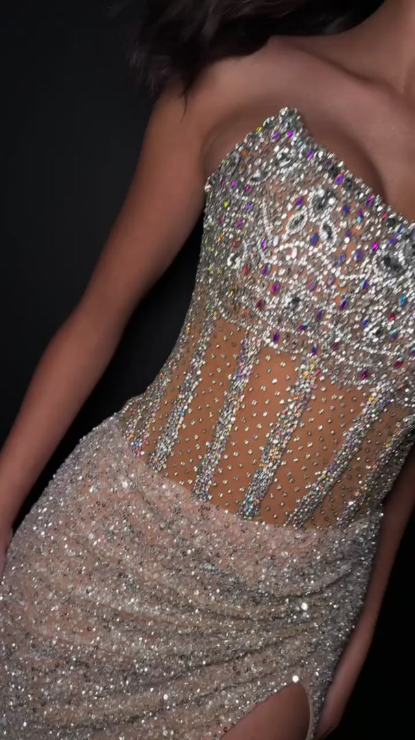 The Ashley Lauren 11830 Prom Dress is a stunning choice for any formal occasion. Adorned with sequins and sheer crystal detailing, this strapless corset gown exudes elegance and luxury. The slit adds a touch of allure while the corset provides a flawless fit. Perfect for making a statement on any red carpet event or pageant stage.&nbsp;Dazzle in this fully beaded gown. The sweetheart neckline is complete with a corset bustier. The skirt is finished with horsehair and a left leg slit.

Sweetheart Neckline