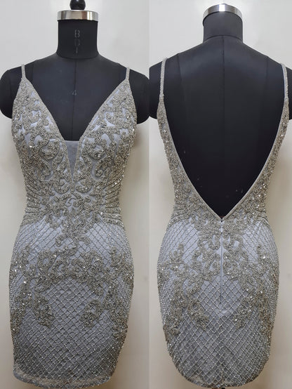 Primavera Couture 4012 Sequin And Beaded Net Design Embellished Bodice V-Neck And V-Back Homecoming Cocktail Dress. Make a statement with the Primavera Couture 4012 dress. Expertly beaded and sequined for an eye-catching sparkle, this v-necks and V-back homecoming dress is sure to shine. 