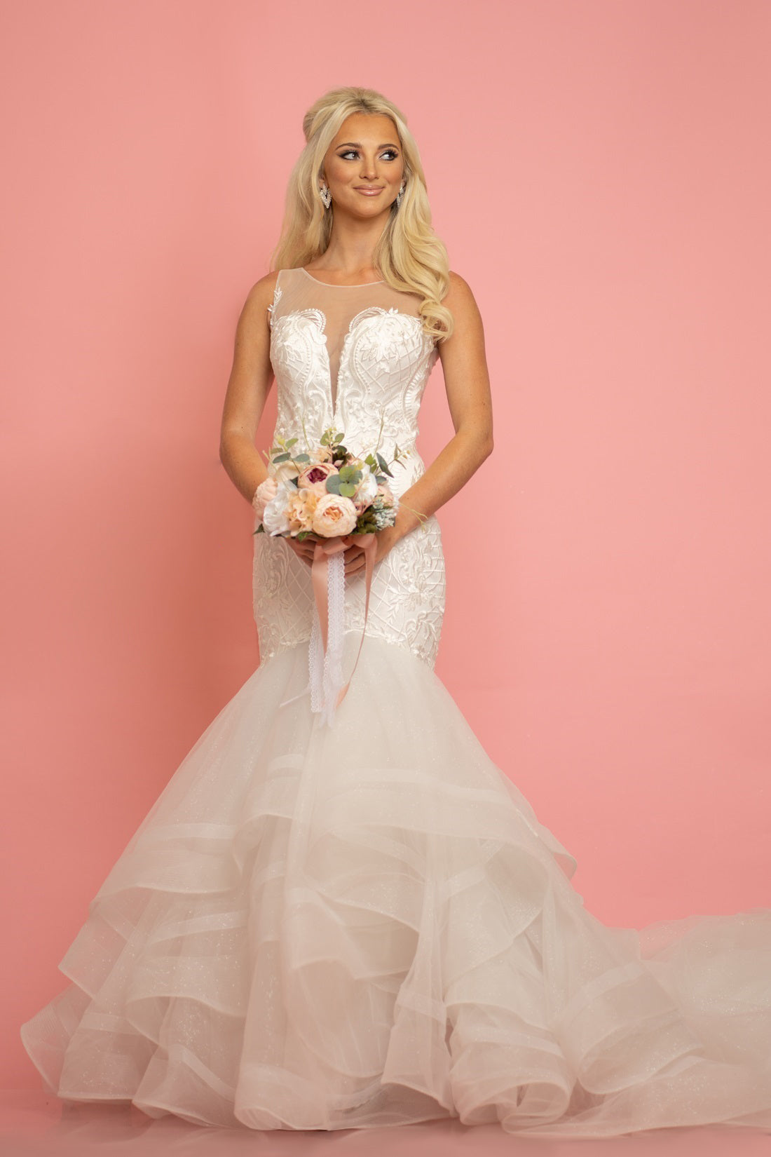 The Johnathan Kaye B314 Size 20 Long Lace Mermaid Wedding Dress is designed for brides who want to make a statement. With a sheer neckline and long train, this dress showcases the elegance of lace and fits perfectly into a mermaid silhouette. The Johnathan Kaye B314 gives you the perfect combination of grace and sophistication.  Size: 20  Color: White Shimmer