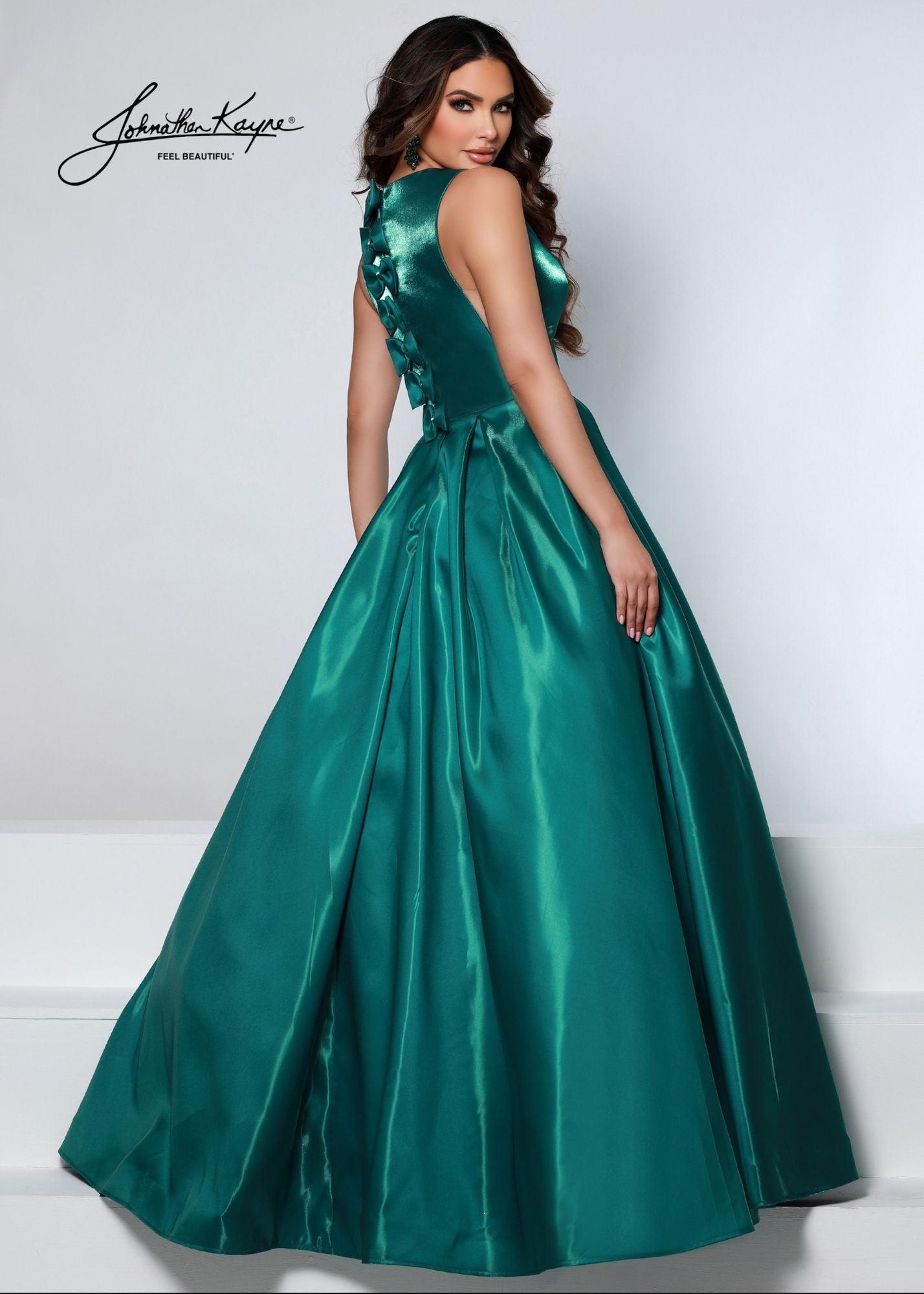 Johnathan Kayne 2550 Size 4 Royal A-Line Ballgown Satin Plunging Neckline Side Cut Outs Bows In Back Prom Gown. This elegant Johnathan Kayne 2550 Prom Gown is crafted in Royal satin fabric and features a classic A-line silhouette. It boasts a plunging neckline, side cut-outs and bows in the back for a luxurious look. Size 4.