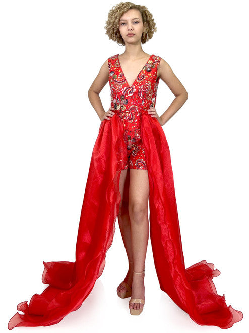 Feel fun and confident in the Marc Defang 8231 formal romper, featuring a stunning sequin fabric and double detachable overskirt for an eye-catching look. Short beading accents add a special touch, creating a perfect pageant or party outfit that will turn heads.  Sizes: 00-16  Colors: Red, Yellow  *Please allow 30 days production