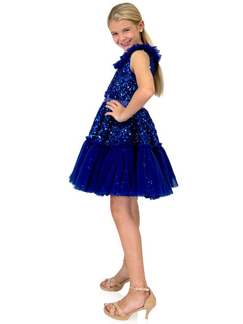 Marc Defang Kids 5111 Dress is a stunning cocktail dress for special occasions. Crafted from sequin tulle with pleated ruffle and layered detailing, it is sure to turn heads. Perfect for pageants, it will make your little one feel like a princess. Please inquire for additional colors.  Sizes: 4,5,6,7,8,9,10,11,12,13,14  Colors: Lilac, Mint, Royal Blue