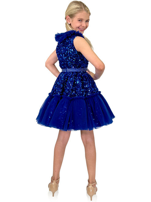 Marc Defang Kids 5111 Dress is a stunning cocktail dress for special occasions. Crafted from sequin tulle with pleated ruffle and layered detailing, it is sure to turn heads. Perfect for pageants, it will make your little one feel like a princess. Please inquire for additional colors.  Sizes: 4,5,6,7,8,9,10,11,12,13,14  Colors: Lilac, Mint, Royal Blue