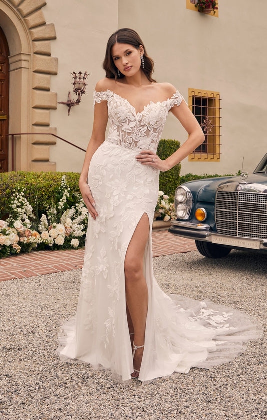 Casablanca Bridal 2541 Augustine A-Line Off The Shoulder 3D Floral Appliques Sheer Corset Train Slit Wedding Gown. Stretch georgette & stretch chiffon lining with beaded & sequined floral lace & 3D floral appliques, all come together to form a glamourous off-the-shoulder bodice with wide lace straps and a sweetheart neckline. A flattering high waist tops the cascading fit and flare skirt with a tigh high slit that ends with a court-length train at back.