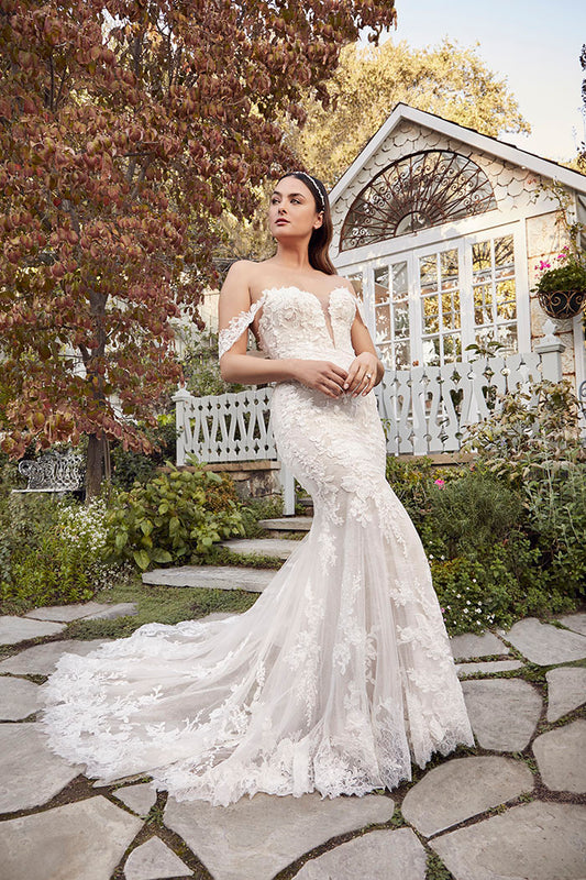 Elegant and ethereal, Style 2491 Palmer by Casablanca radiates feminine romance. Detachable off-the-shoulder sleeves connect to a strapless plunging neckline for a wedding day style as vibrant as it is versatile. Stretch lining and Chantilly lace complement your natural curves in this fit-and-flare gown with 60" train. Rich in floral appliqués, delicate beading, and sequins, Palmer exudes subtle shimmer with every step. Pair with a long, dramatic, flowing 125" cathedral veil to complete the look.