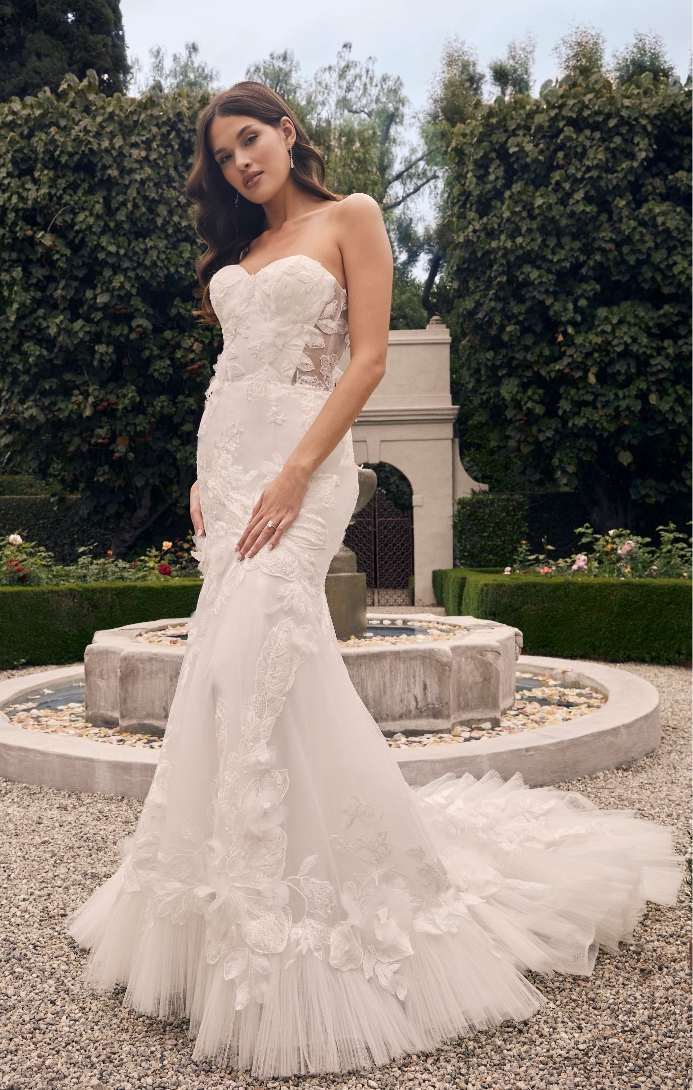 Casablanca Bridal 2552 Fit And Flare Strapless Sweetheart Neckline Floral Tulle Corset Train Wedding Dress. This beautiful fit-and-flare style is anything but ordinary. Stretch chiffon lines the entire gown, so you’ll be equally comfortable and glamorous all day long. A strapless sweetheart neckline is supportive, and the structure of the bodice is like no other with 13 pieces of boning