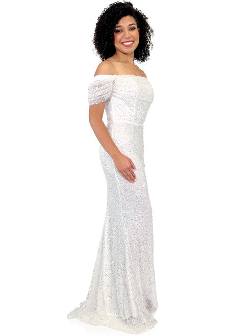 This Marc Defang 8228 dress is an elegant, fitted off-the-shoulder design, featuring a detachable overskirt and ornate pearl, sequin, and beaded detailing. It's perfect for a unique prom, pageant, or wedding look. Corset back  Sizes: 00-16  Colors: Hot Pink, White  *Allow 30 days production
